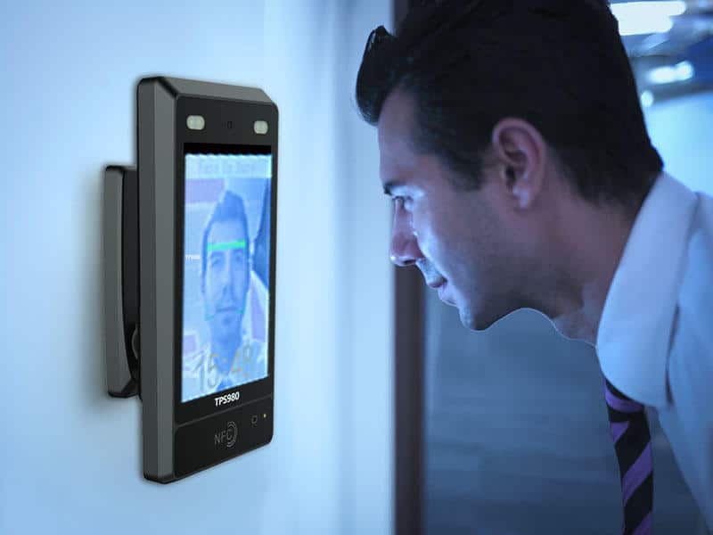 Person using fingerprint access control panel